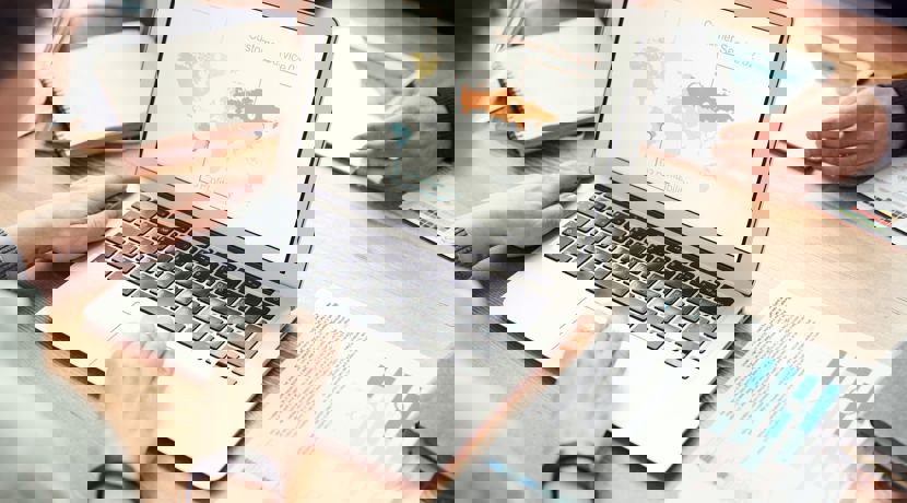 Person looking at world map on their laptop screen.