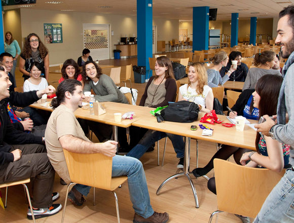 Group of students enjoying their lunch break in a canteen.