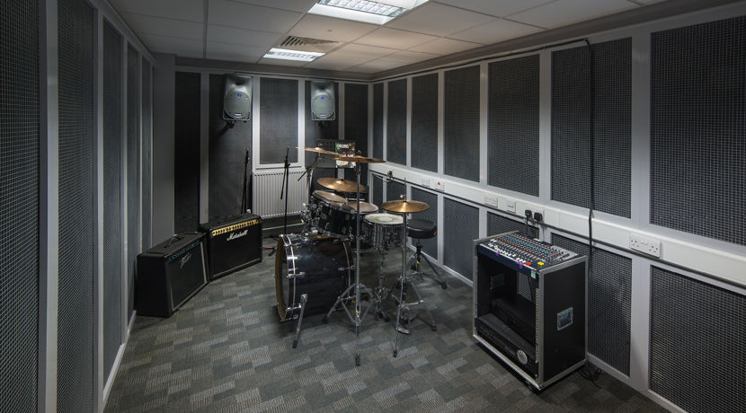 Drum kit and amps in a recording studio at Edinburgh College.