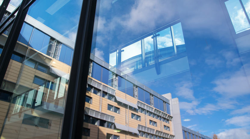 Looking out a window to Granton campus building.