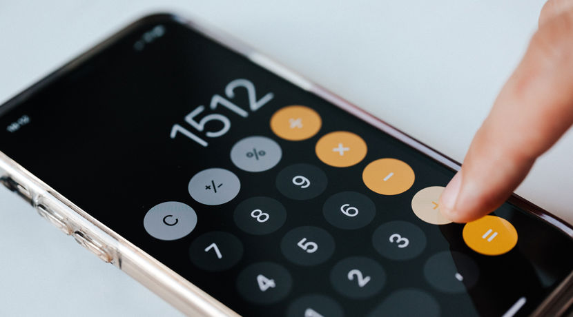 Smartphone calculator on a desk.